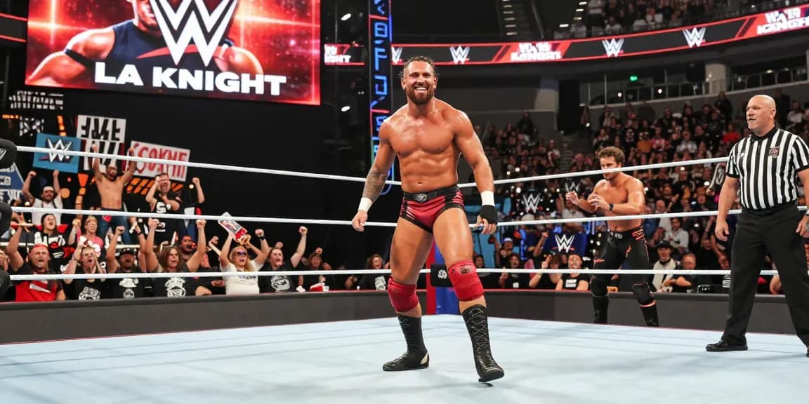 LA Knight enters the wrestling ring with charisma and confidence during a WWE event, surrounded by enthusiastic fans and vibrant visuals.